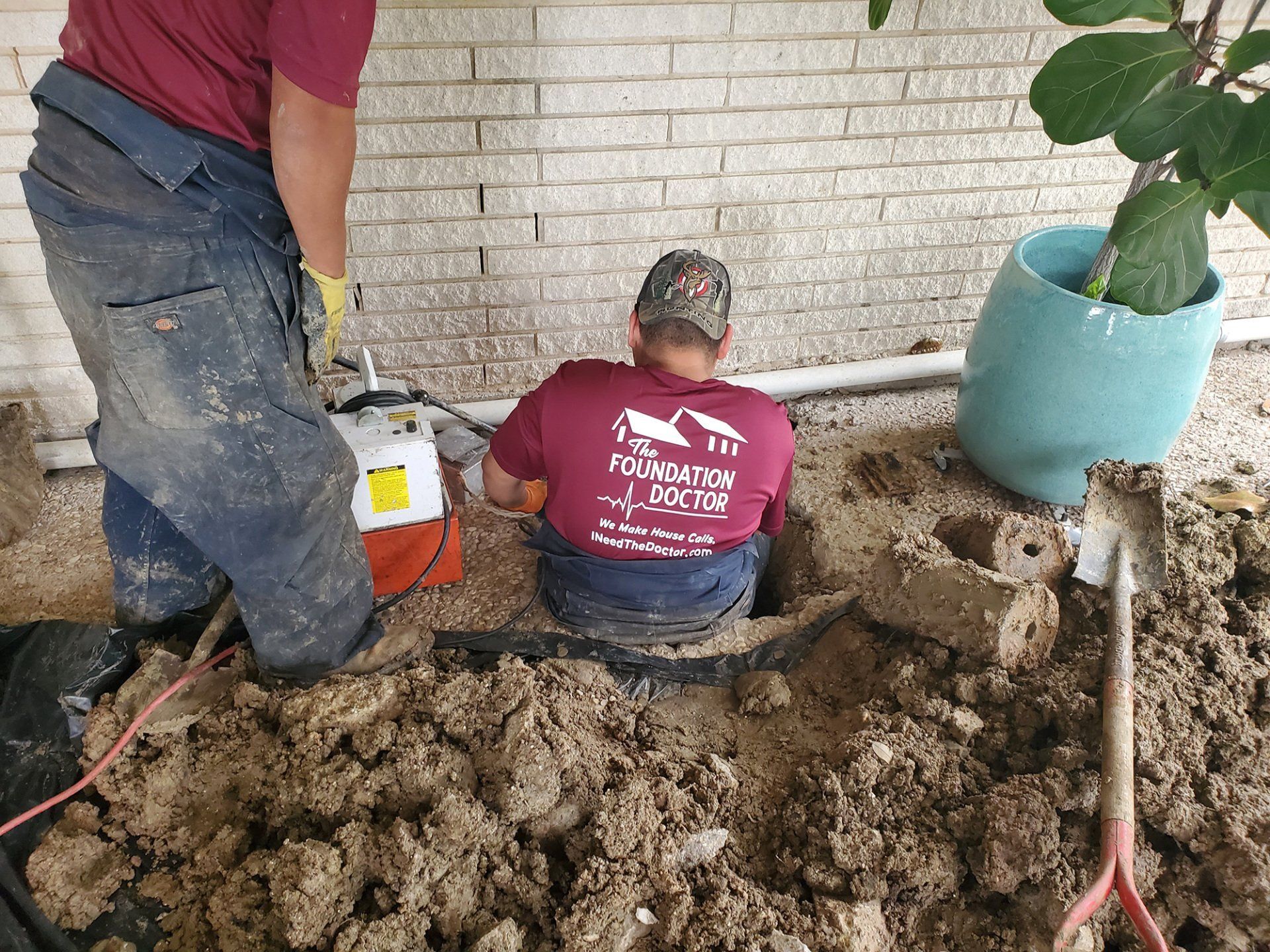 The Foundation Doctor crew repairing the foundation of a brick home in Waco, Texas